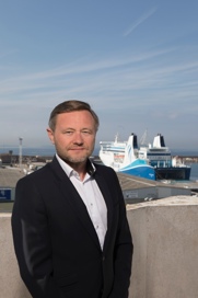 Luc Szczypa in front of a passenger ship